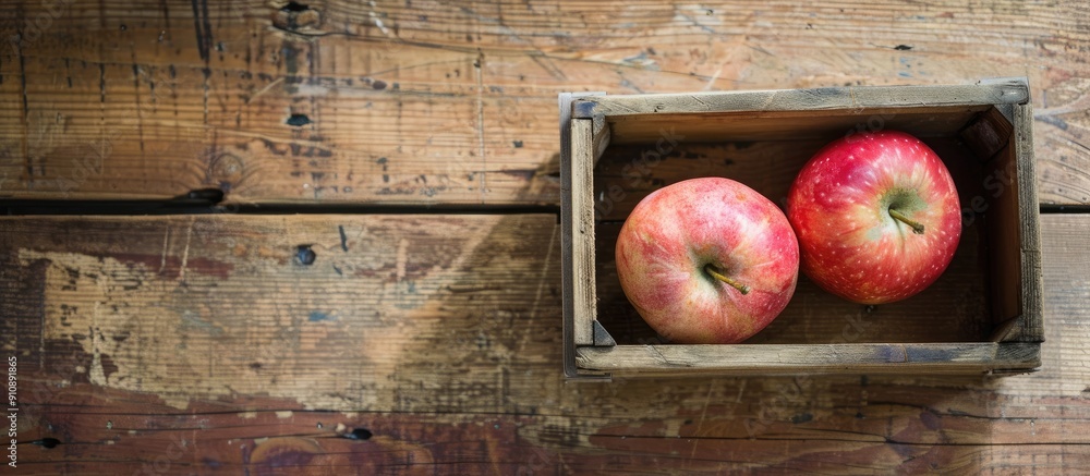Poster a lovely pink apple lies in the box on a wooden floor representing a healthy fruit option with a cle