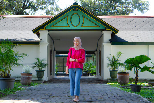 Asian Indonesian muslim tourist woman traveling inside kraton Yogyakarta sultanate palace