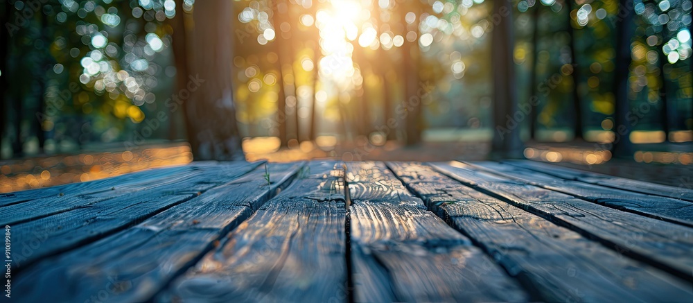 Aufkleber product displayed on a wooden table with a blurred background of trees with bokeh effect providing a