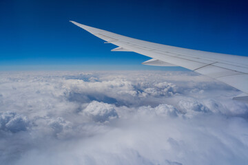 View from an airplane on a blue sky and white clouds