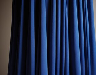 Heavy pastel colored fabric hangs with many folds