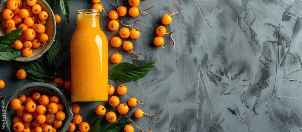 Aufkleber gray table with a delicious sea buckthorn juice bottle allowing for copy space image