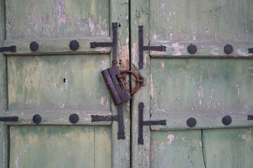 Old door locked with an ancient Chinese key.