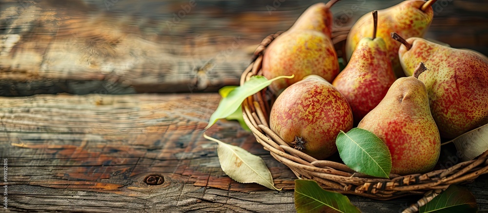 Poster copy space image of organic ripe pears displayed in a rustic basket on a wooden table promoting heal