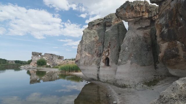 The interesting nature of Lake Emre in the Phrygian valley. Historical rock houses. 4k video 