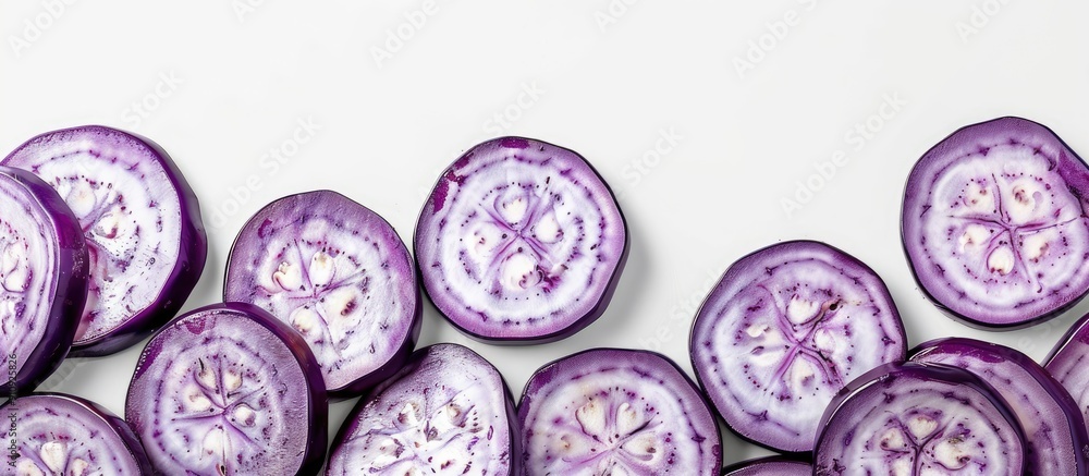 Poster Eggplant slices arranged in circular pattern on white backdrop Isolated with copy space image for decorative frame or border on a food themed background