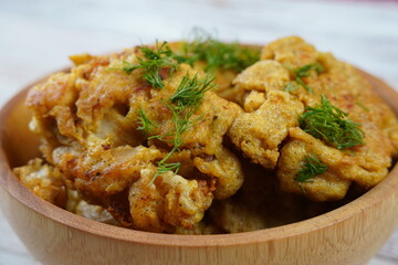 Fried fish in batter in a bowl