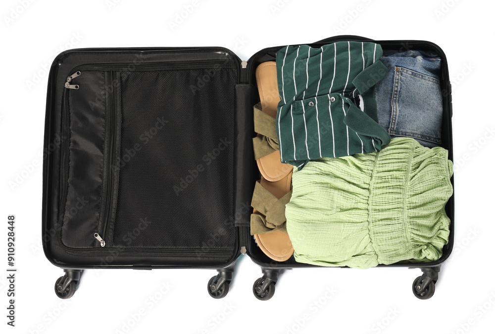 Wall mural Open suitcase with clothes packed for travelling isolated on white, top view