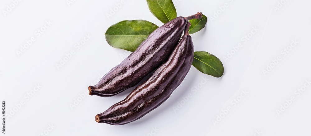 Aufkleber ripe carob on a white backdrop with copy space image