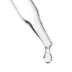 Dropper with clear cosmetic oil on white background