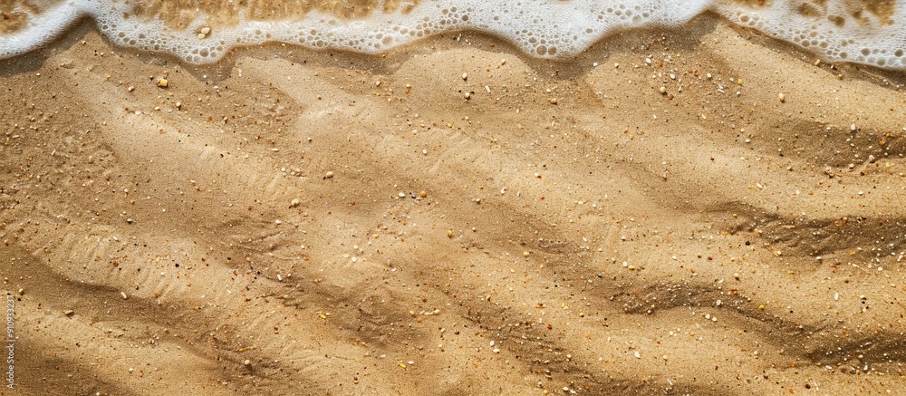 Aufkleber Top view of sandy beach providing a textured background with ample copy space image