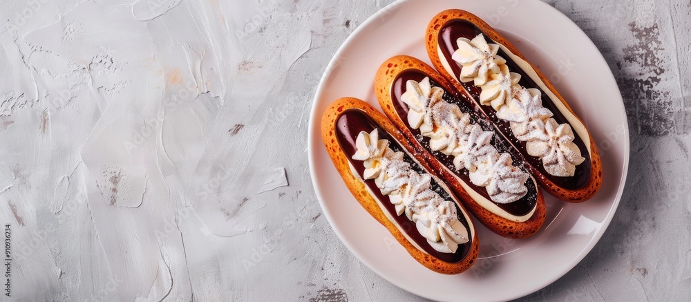 Leinwandbilder top view image of eclair cakes on a white plate with copy space image