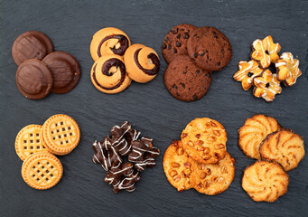 Mix of cookies . Many unhealthy snacks . Top view