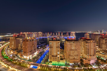 Fototapeta premium Doha, Qatar - April 01, 2024: Aerial view of Peral Qatar Porto Arabia