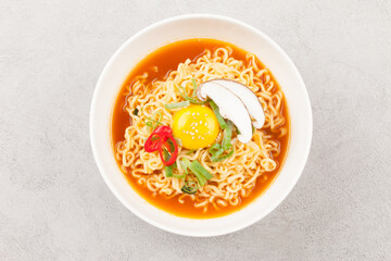  An instant food made by steaming noodles, frying them in oil, and then drying them. Add powdered soup separately.