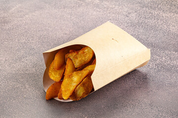 Fried rustic golden potato heap