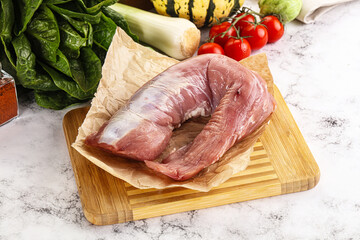 Uncooked raw pork tenderloin with spices