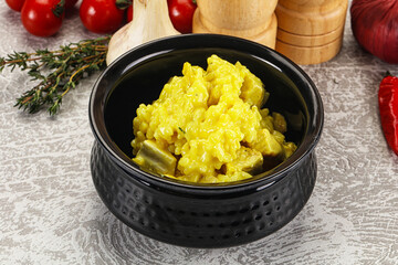 Italian cuisine - yellow risotto with chicken