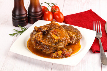 Italian cuisine - ossobuco with sauce