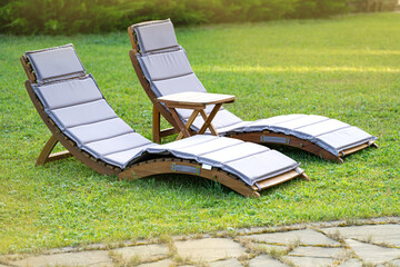 Two sunbeds standing in the garden for relaxation
