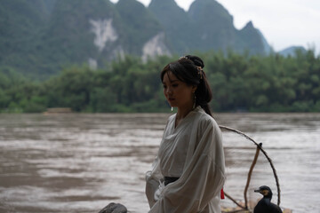 Hanfu-Clad Woman on Bamboo Raft in Xingping, China