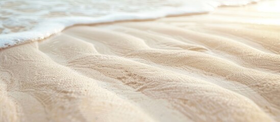 Close up of a textured white sandy beach with a wavy pattern natural grains clean rippled surface...