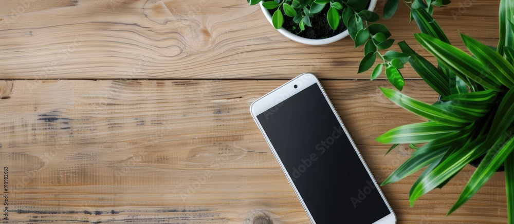 Aufkleber wooden desk showcasing a white smartphone with a blank screen for copy space image