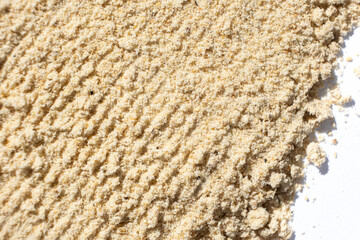 Abstract beige ground ginger background. Creativity in cooking.