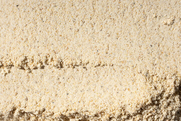 Abstract beige ground ginger background. Creativity in cooking.