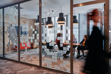In the dynamic hustle and bustle of a business environment, a group of young business professionals...