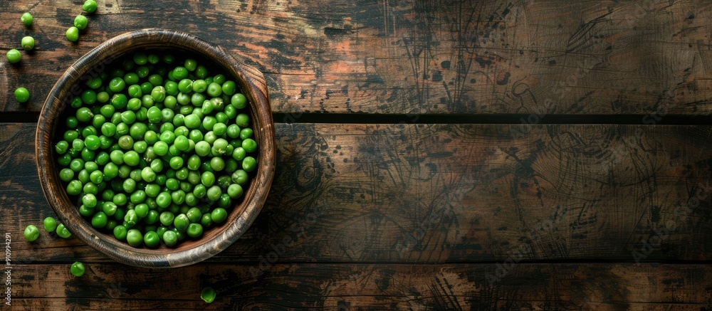 Poster Peas in a bowl on a wooden surface with a blank space for an image. copy space available
