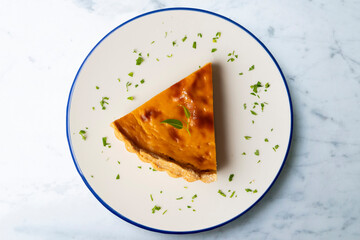 Delicious piece of American pumpkin pie in an overhead view.