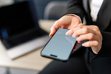 Close-up of female hands interacting with a blank white screen. Ideal for adding your custom design or text to promote your brand or business.