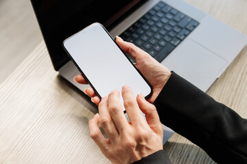 Close-up of female hands interacting with a blank white screen. Ideal for adding your custom design or text to promote your brand or business.