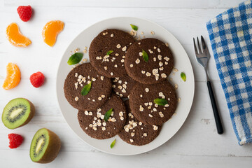 Delicious vegan chocolate cookies made with oats.