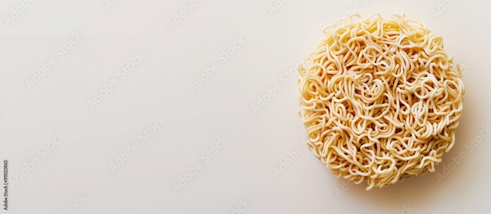Poster top view of dry, uncooked whole instant noodles on a white background with soft lighting and space f