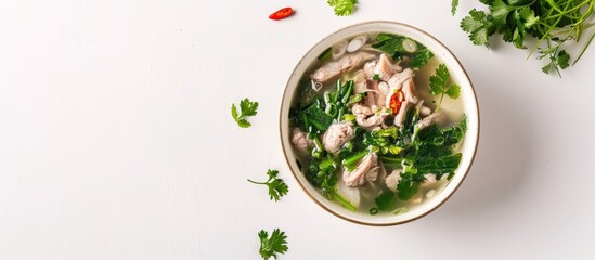 Traditional Taiwanese food called Four Tonics Soup or Four Herb Flavor Soup featuring Job's tears, herbs, and pork intestines in a setting of white backdrop with ample copy space image.