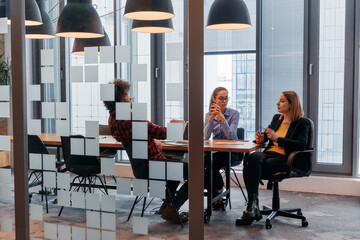 In the dynamic hustle and bustle of a business environment, a group of young business professionals...