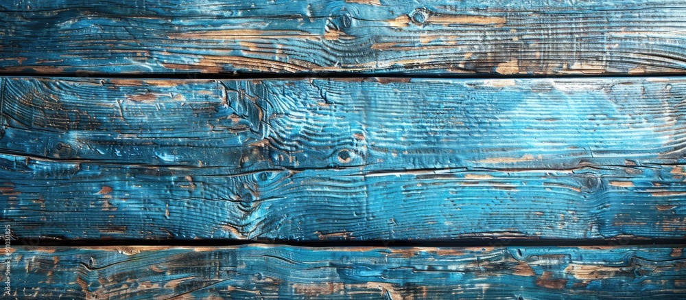 Poster weathered blue-painted wooden board with aged texture provides a rustic background with an empty cop