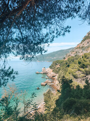 Stunning Serra Arrabia coastline with a breathtaking beach and crystal-clear blue water. Perfect for travel and vacation themes, showcasing serene coastal beauty and scenic natural landscapes.