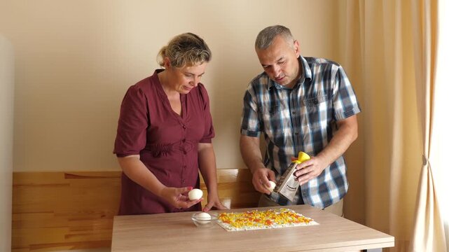 A boiled egg is rubbed on the lavash roll.