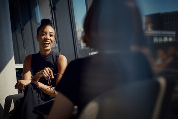 Young business colleagues discussing with each other at office