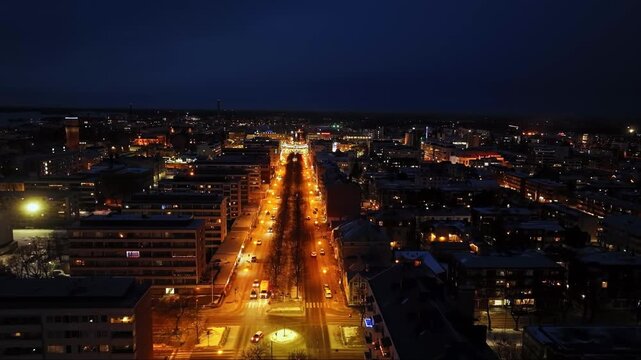 Drone flying over the Kauppapuistikko street, winter night in Vaasa, Finland