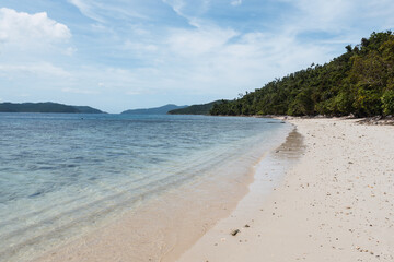 Awesome tropical landscape in the Philippines. dreamed beach with palm trees, white sand and blue water