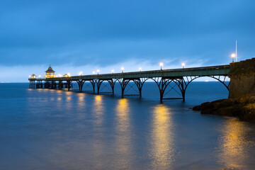 The Grade 1 listed 'Cleveland Pier' in the Bristol Channel illuminated at dusk