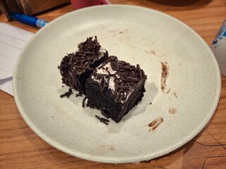 Chocolate brownie cake on a white plate