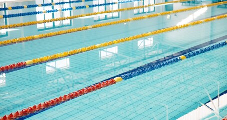 Swimming pool, empty and lines with game, fitness and water for sports, cardio workout and lanes. Competition, blue and swim training arena ready for race performance, dividers and exercise challenge