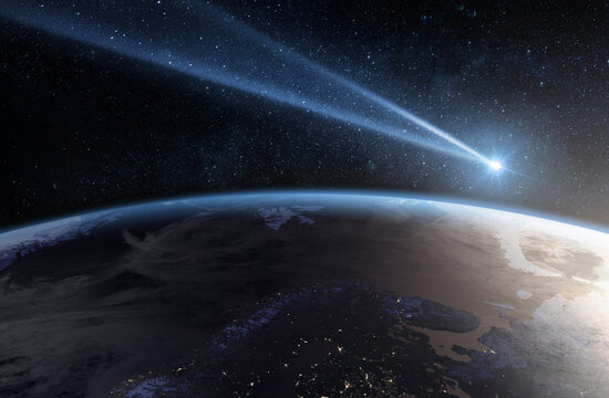 Comet, asteroid, meteorite flying to the planet Earth.  Glowing asteroid and tail of a falling comet threatening the safety of the Earth.  Elements of this image furnished by NASA.