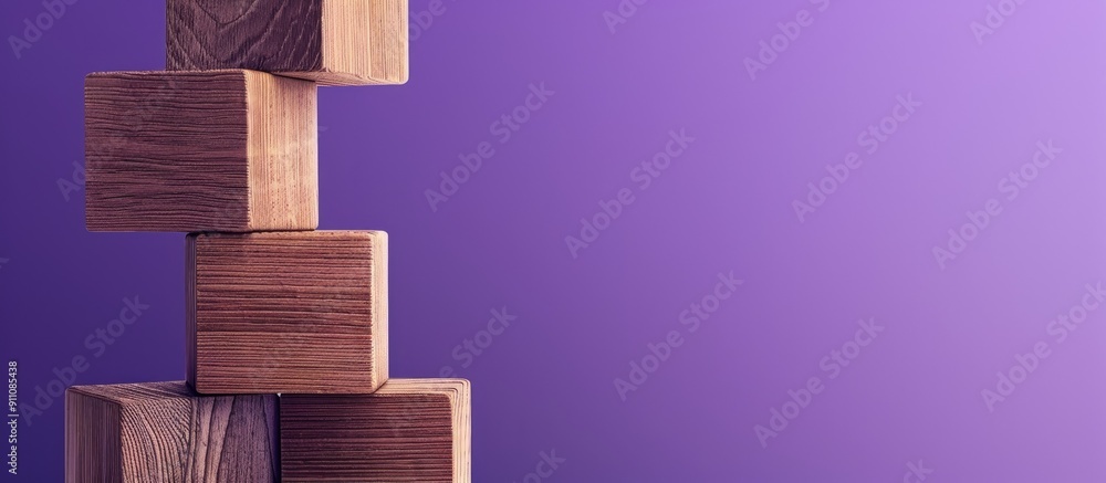Poster wooden blocks carrying a personal growth message are set against a purple backdrop serving as a symb
