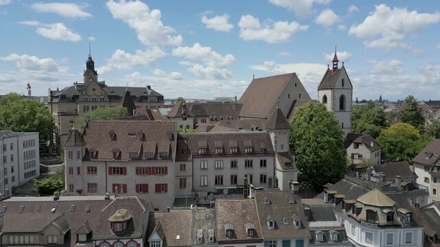 4K Drone Video of Historic Churches and Homes in downtown Basel, Switzerland (Truck Right)
